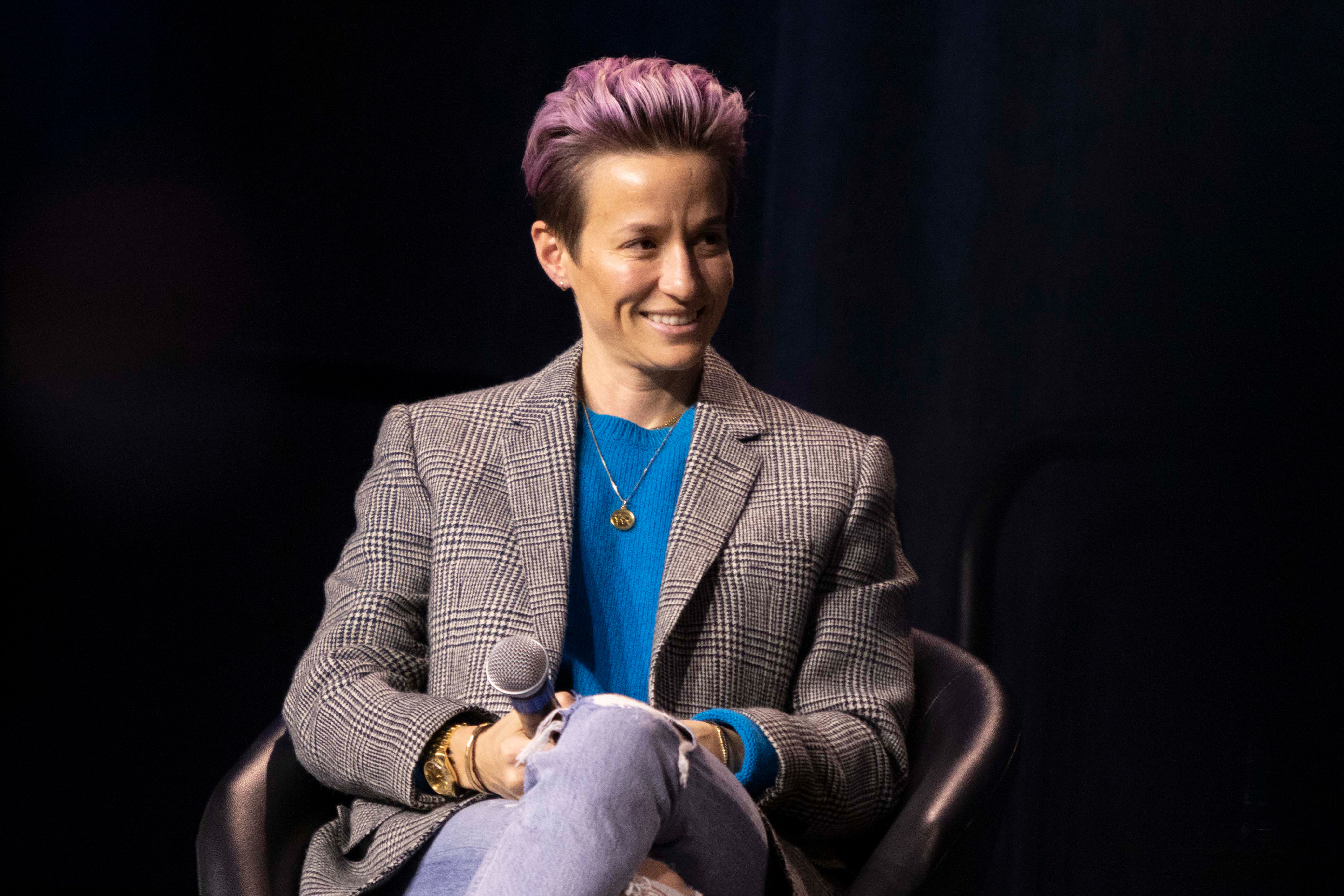 Megan Rapinoe with a microphone during Drake's Bucksbaum Lectureship Series