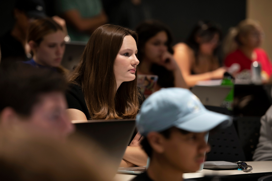 Students sit in a classroom, learning