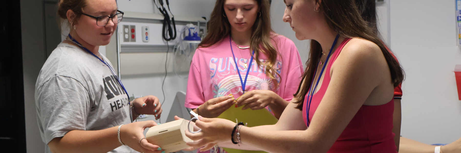High school students at the Bulldogs in Healthcare summer camp work together on a scavenger hunt in the nursing building