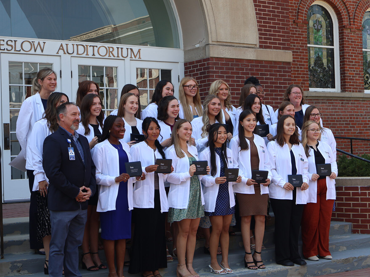 2026 Coating Ceremony Group Photo in front of Sheslow Auditorium 