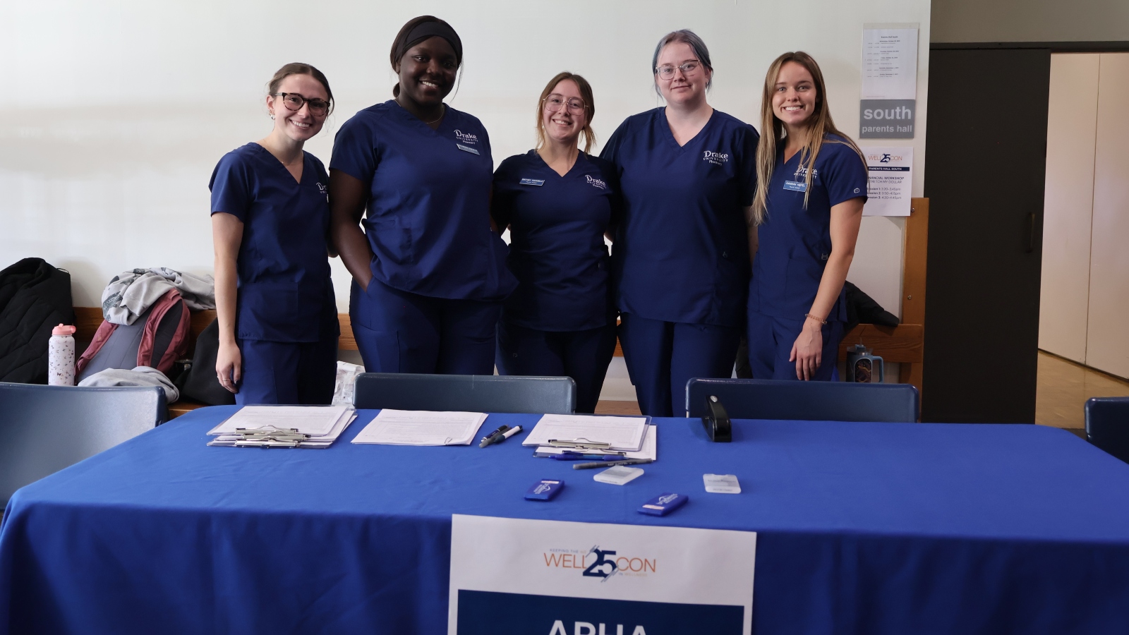Group of Drake pharmacy students tabling at a wellness convention