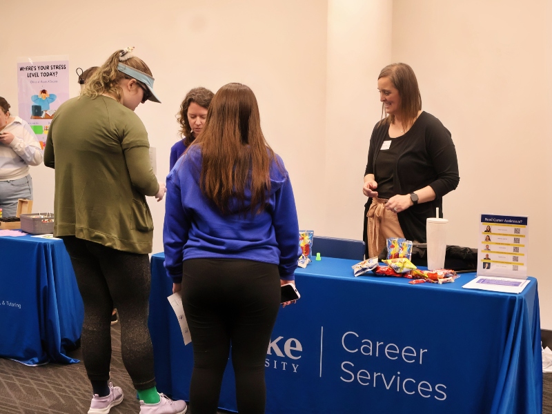 Drake students visit the Career Services booth and talk to staff