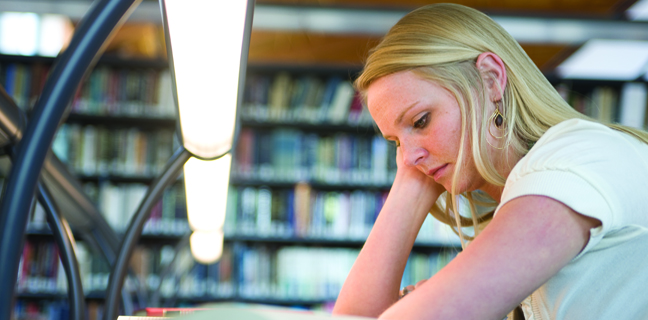 Image of girl studying at the law library