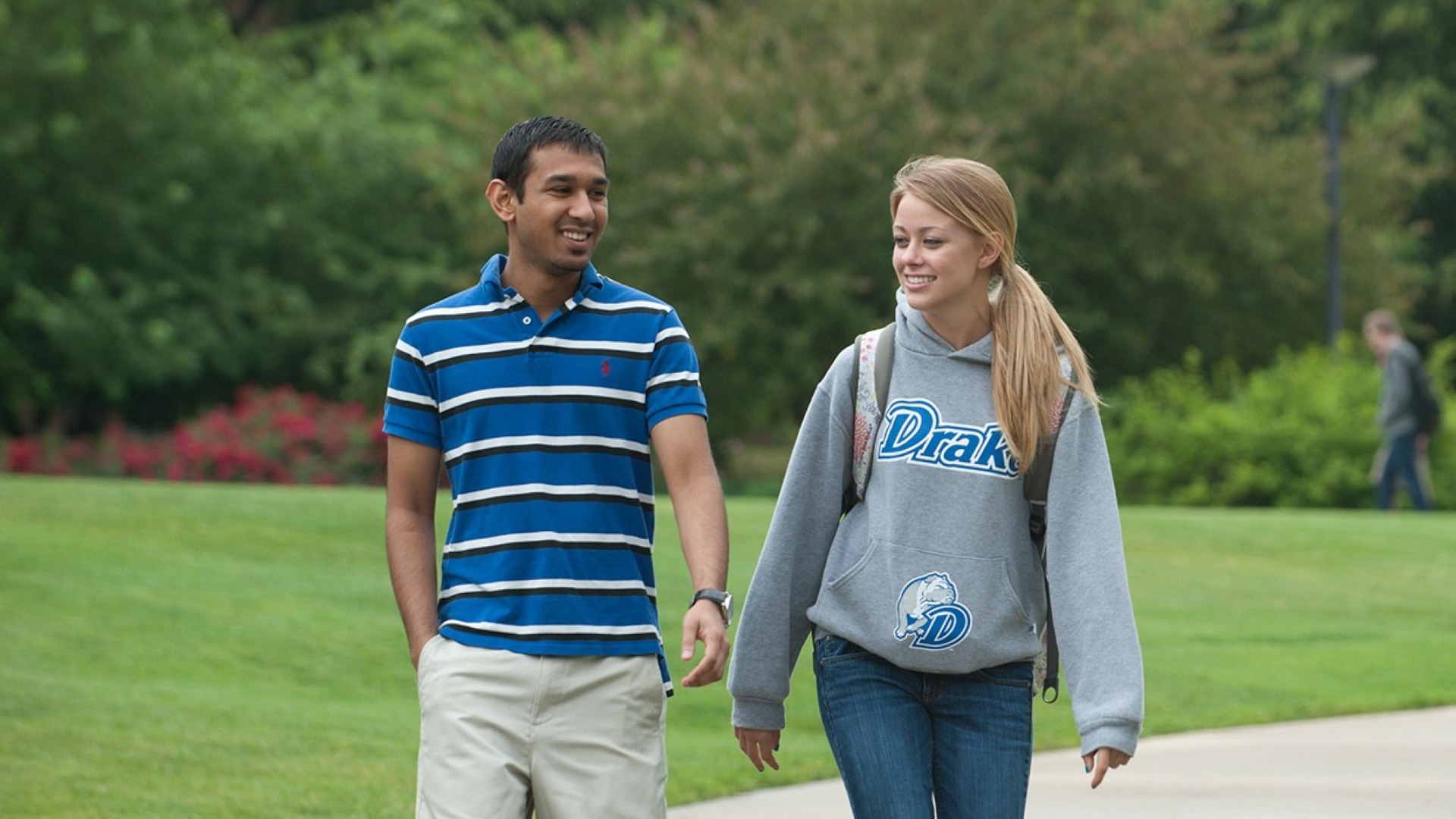 Two students walking outside on campus
