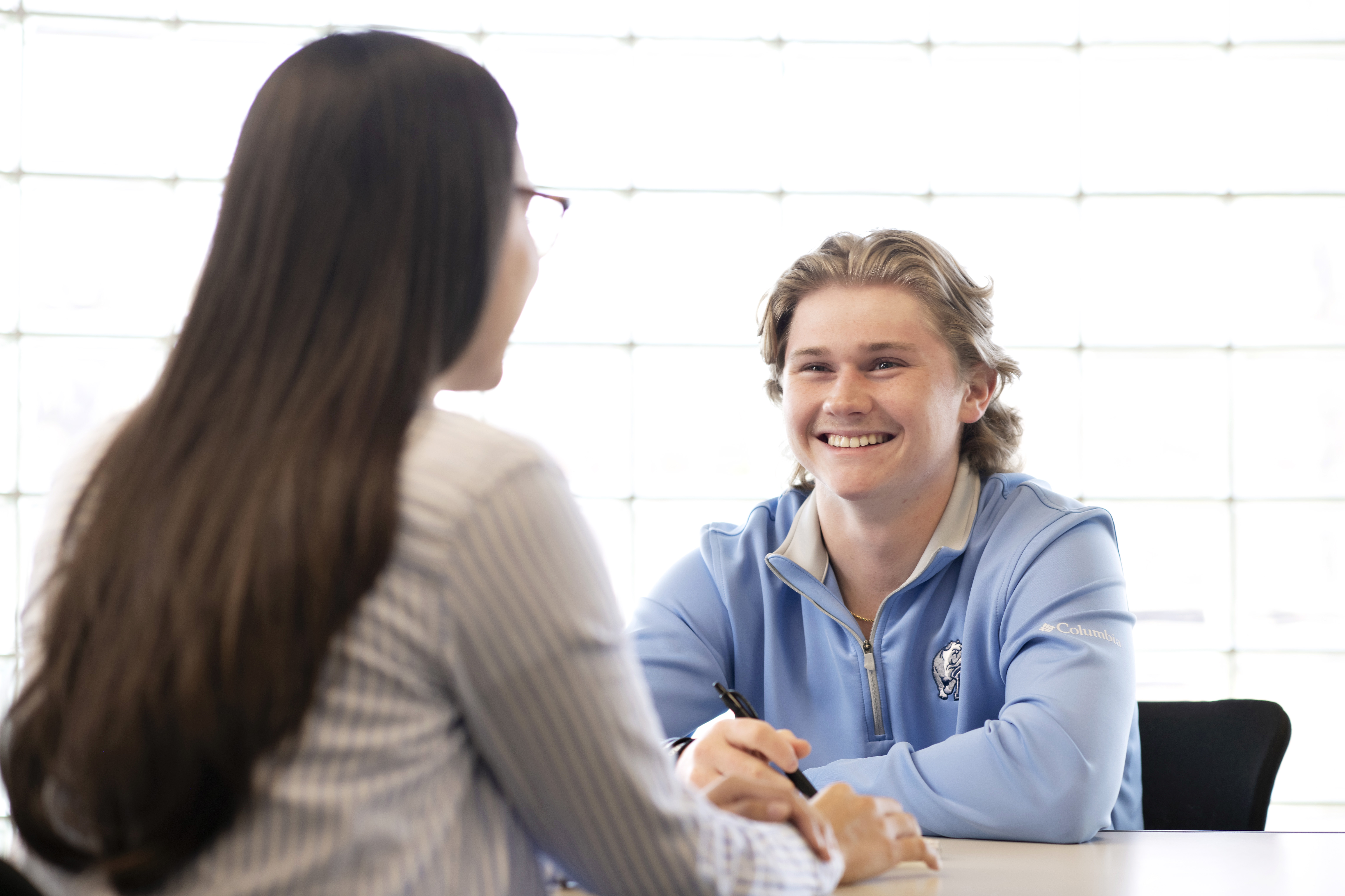 Drake student meeting with another individual to practice interviewing