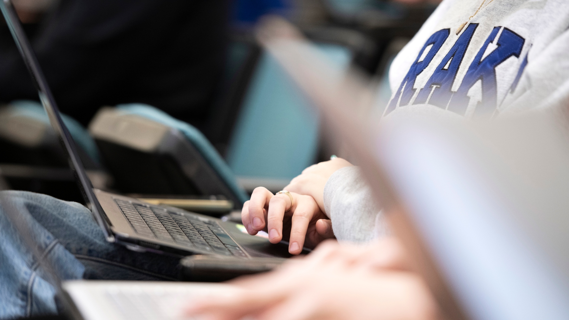 Close up of a Drake student's hand typing on a laptop 