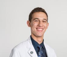 A student in a white coat