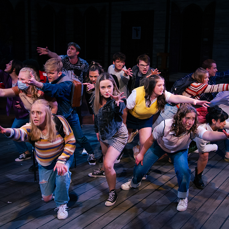 Students on stage during a theatre production