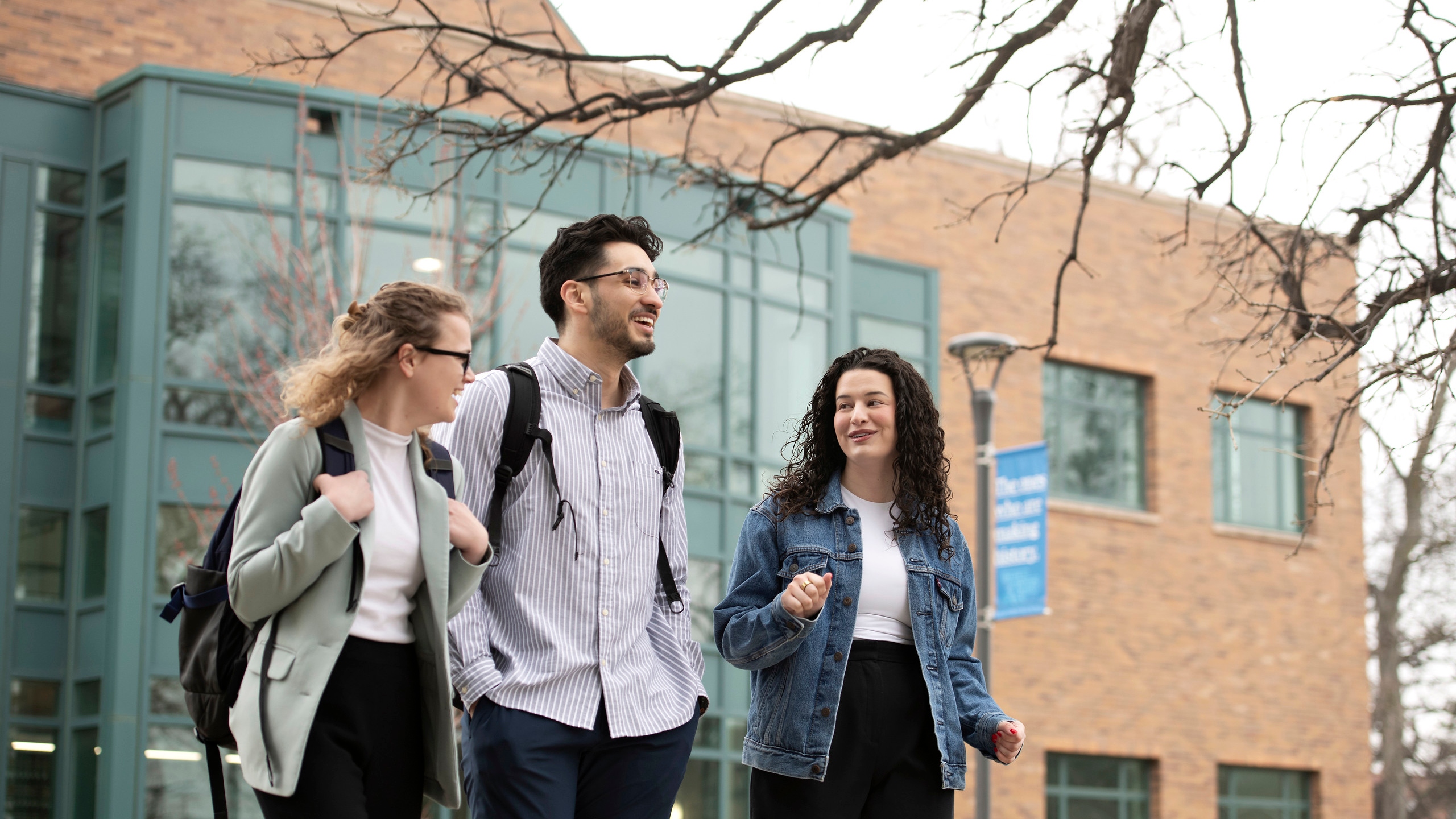 Students enrolled in Drake University's Journalism/Law 3+3 program converse as they walk through campus