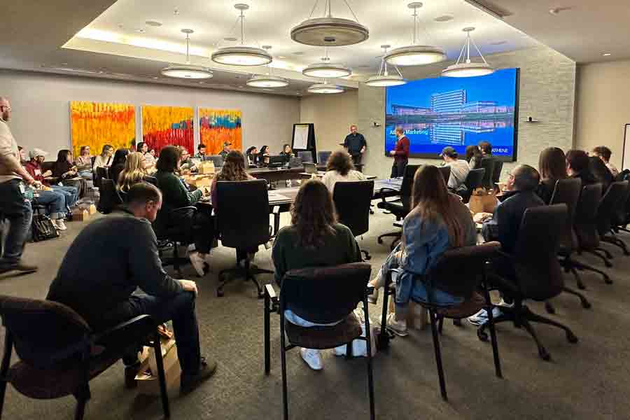 Drake Advertising students listen to a presentation during the AAF Ad Agency Crawl