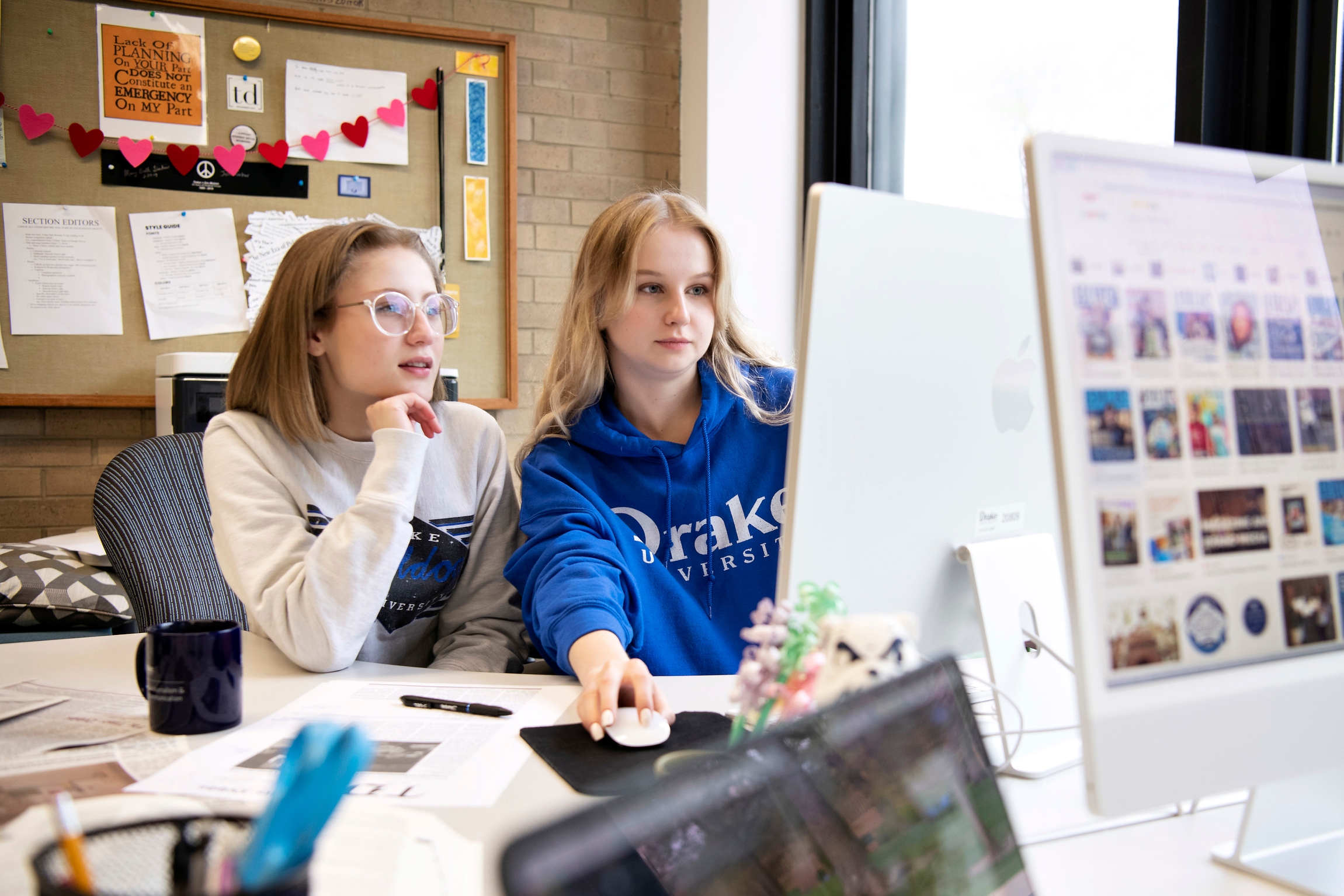 Ahead of an internship, two Drake Advertising Majors finalize their ad campaigns in a campus computer lab