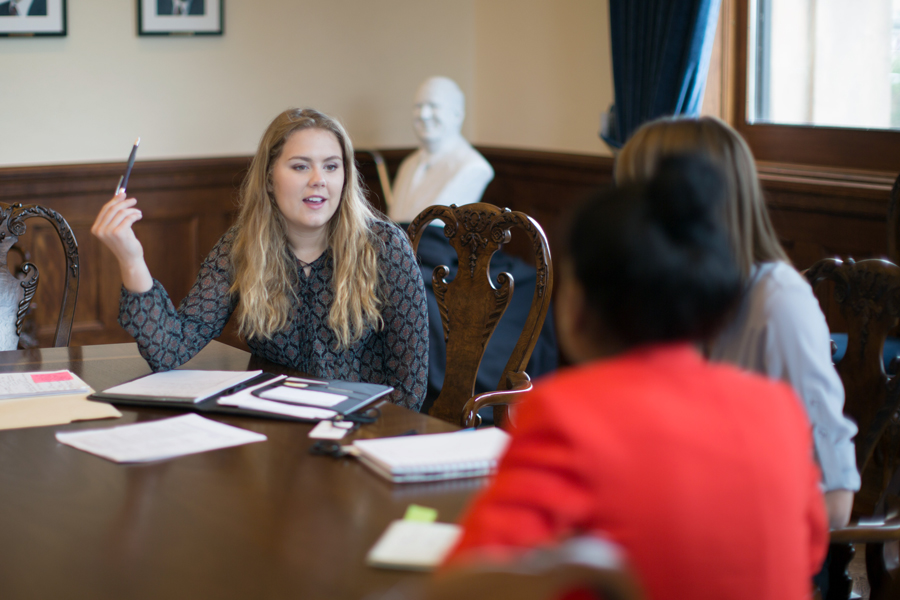 American Politics students from Drake hold a discussion in a courthouse room