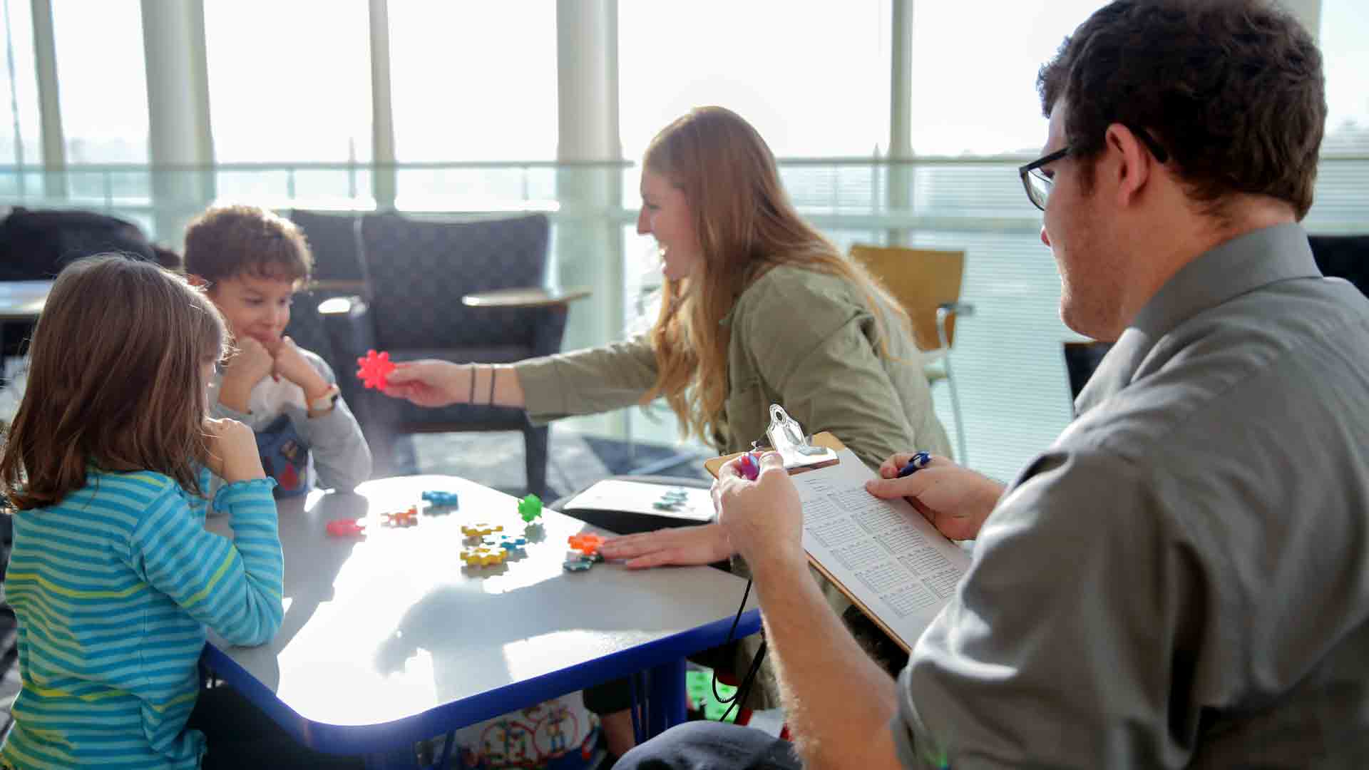 Students enrolled in Drake's Behavior Analysis of Developmental Disabilities program interact with school children during a field assignment