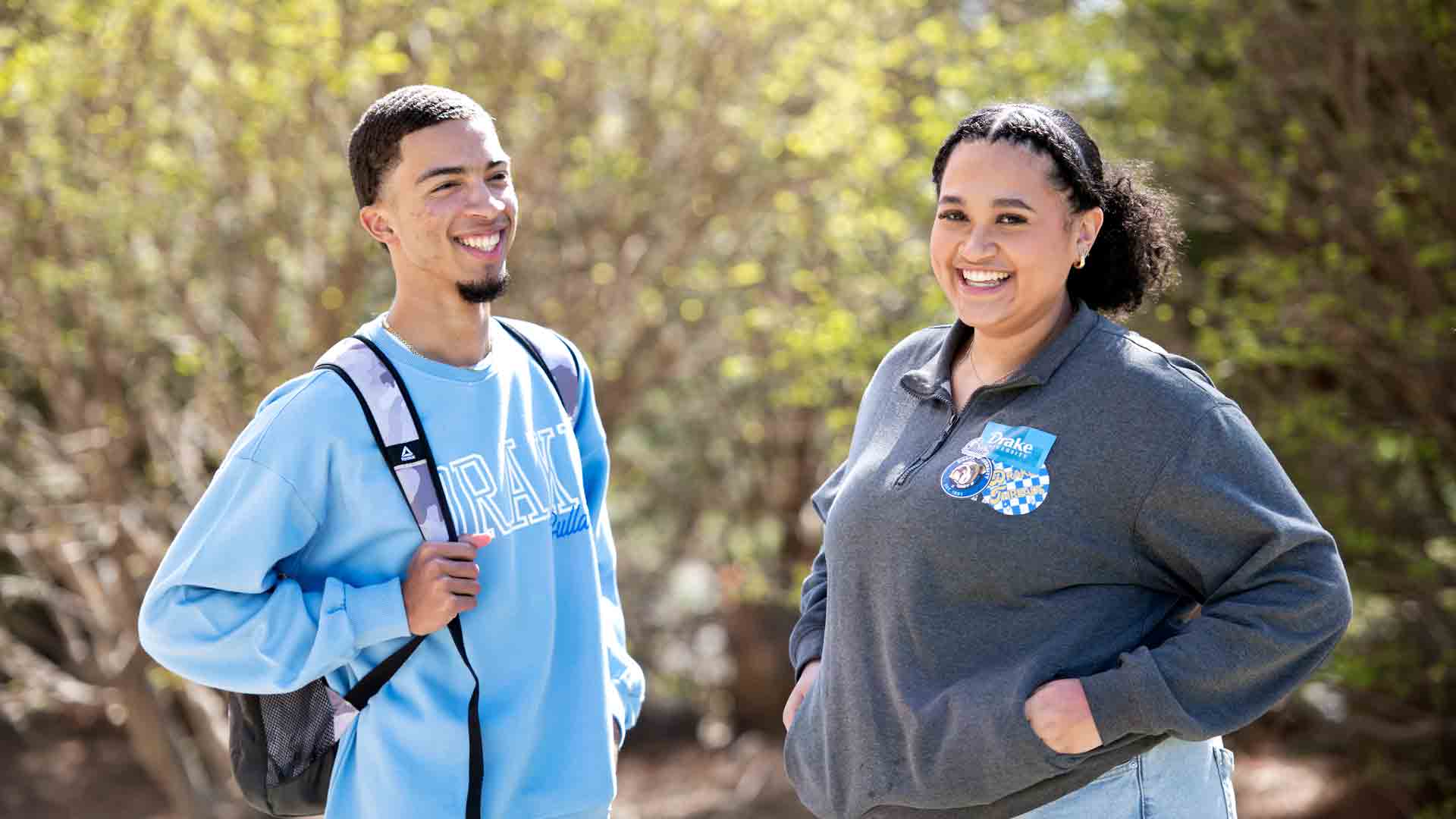 Two students participating in Drake's Black Diaspora Studies program engage in conversation outdoors