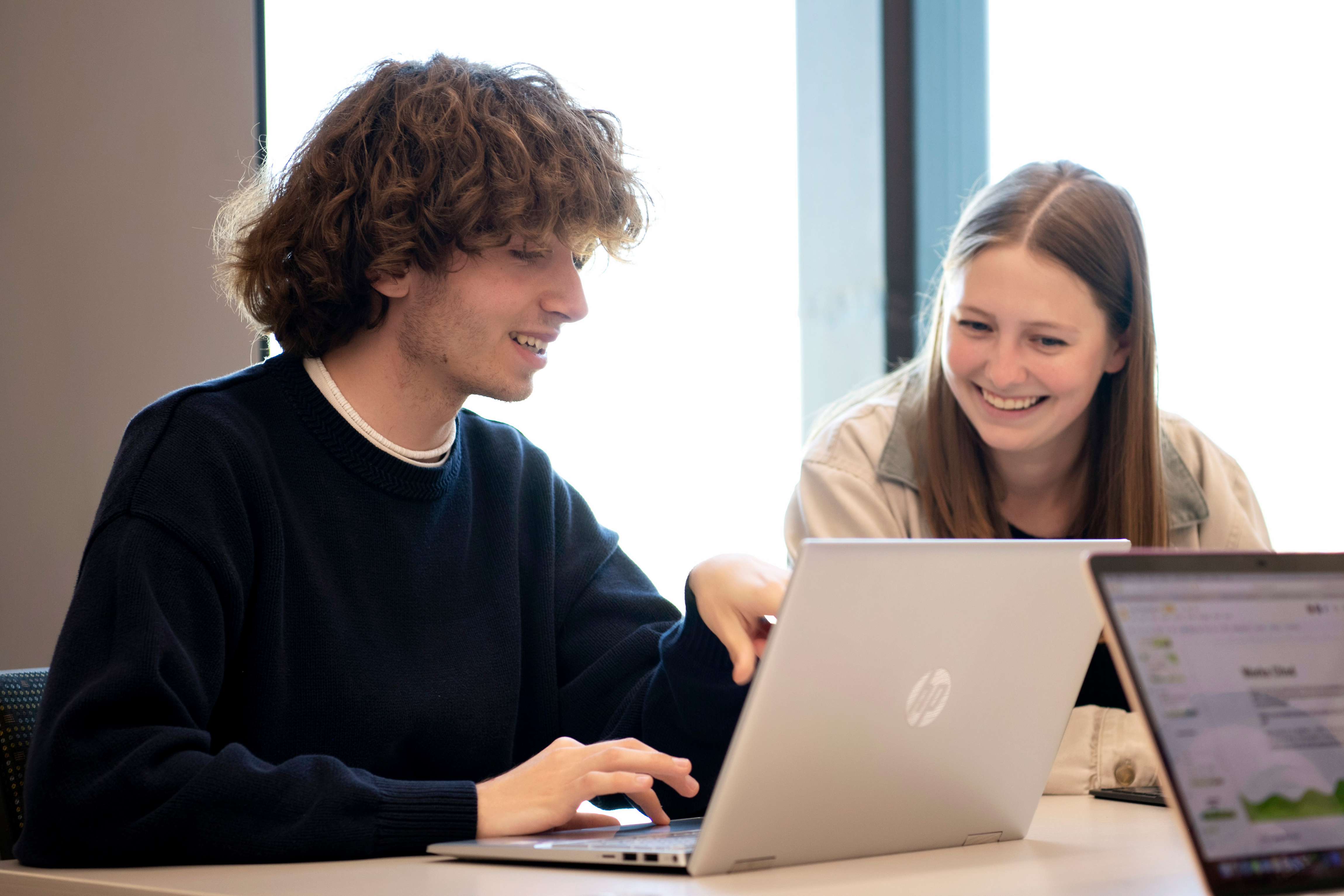 Using their laptops, Drake Computer Science students learn about potential career paths