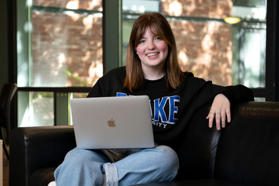 A Creative Writing student works on an assignment in a common area on the Drake campus