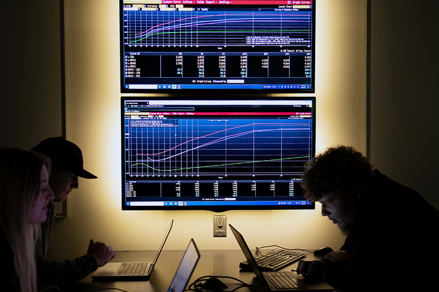 Drake Finance majors connect their laptops to Bloomberg software to learn how to analyze market data