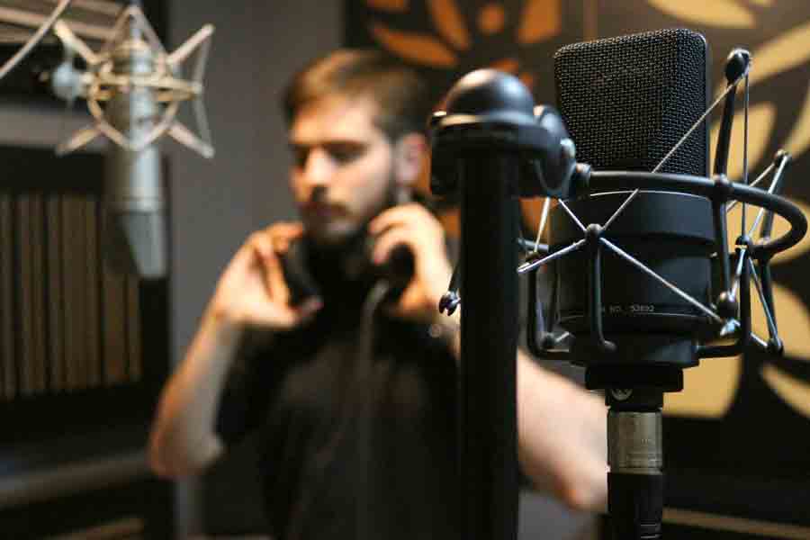 A Drake Jazz Studies students prepares to lay down a vocal track in a campus recording studio