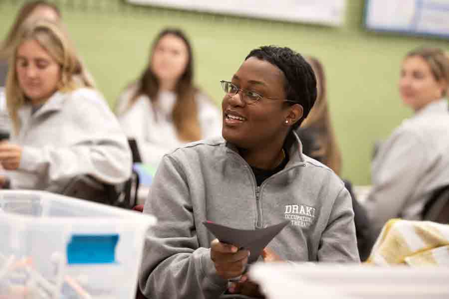 For a Kinesiology-related student organization, students begin to work on a project with markers and colored paper