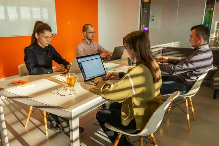 Interns from Drake's Magazine and Brand Media program work on assignments in the People Inc. office