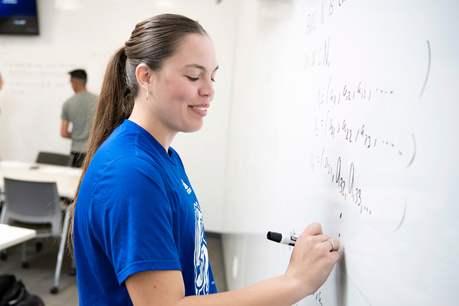 Looking to qualify for the Basil E. Gillam First Year Award, a Drake Mathematics student shows off their problem-solving skills on a whiteboard