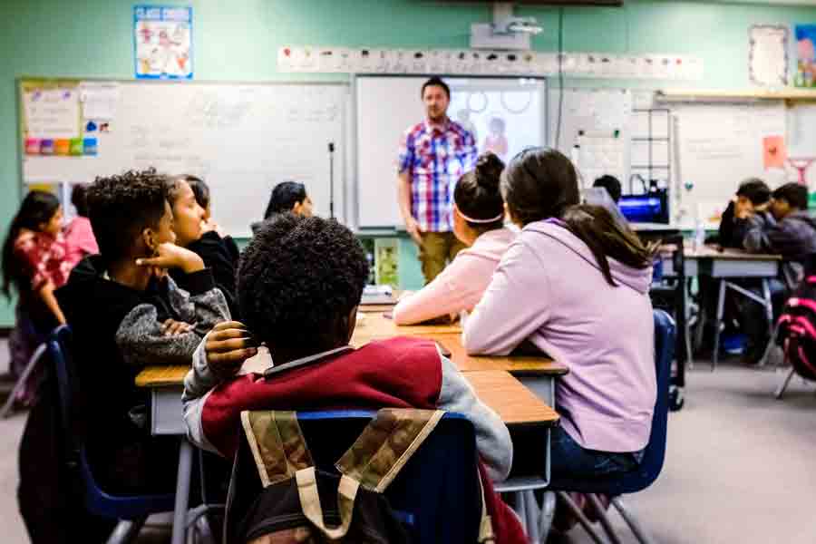 A student in Drake's Mathematics for Secondary Education program practices their teaching skills to a classroom of area students