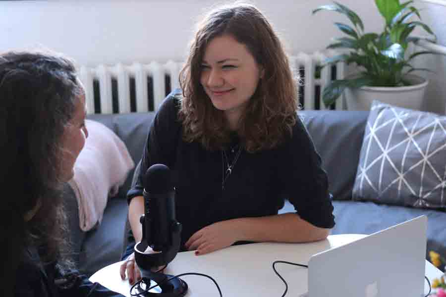Two Multimedia Journalism students from Drake practice their podcasting skills with an applied assignment