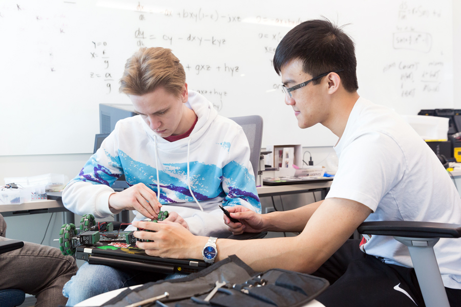 Two students build a rolling robot to compete for the Drake Physics Prize