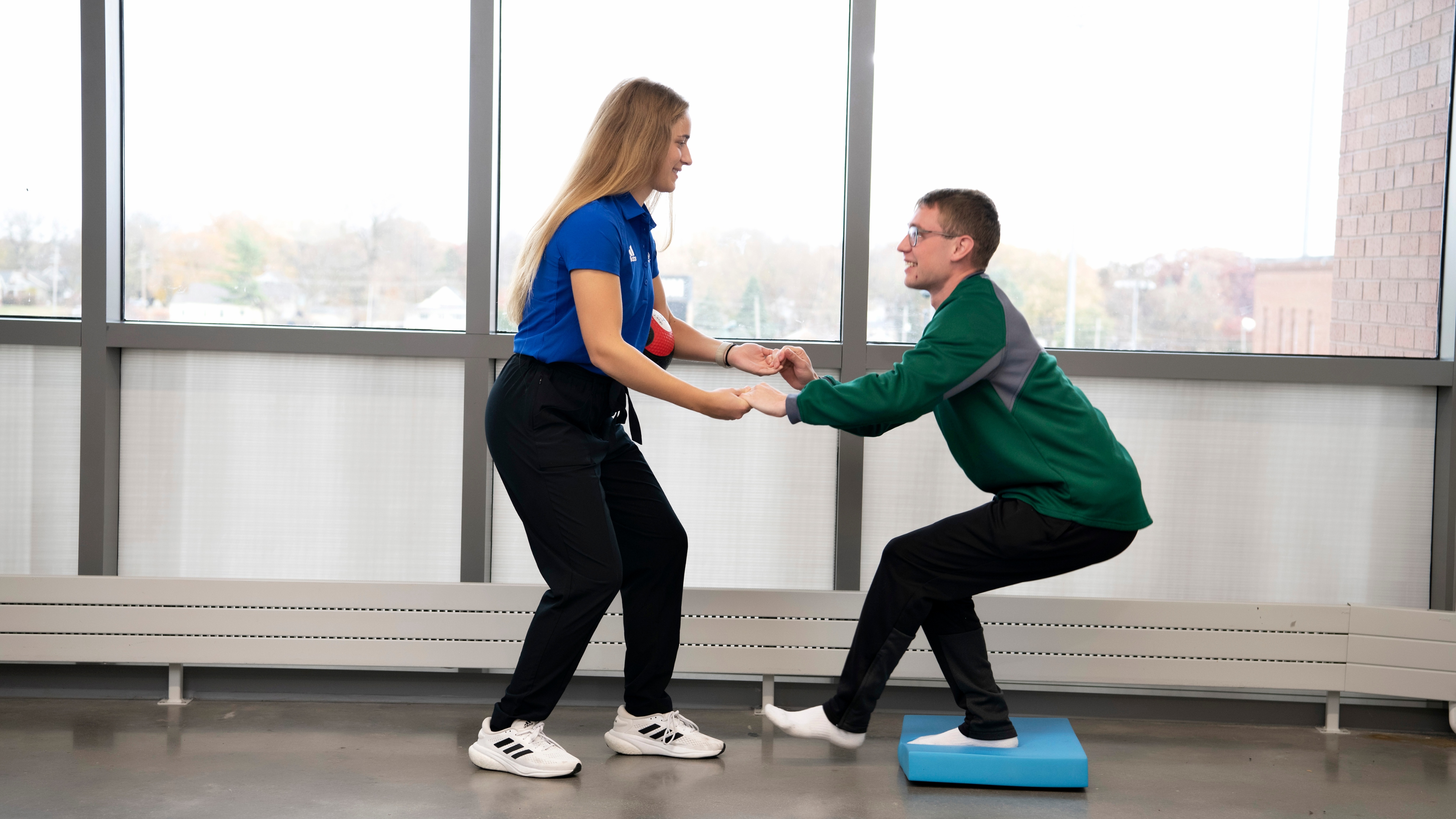 Drake Pre-Athletic Training students practice monitoring balance and other performance attributes on each other in a campus lab