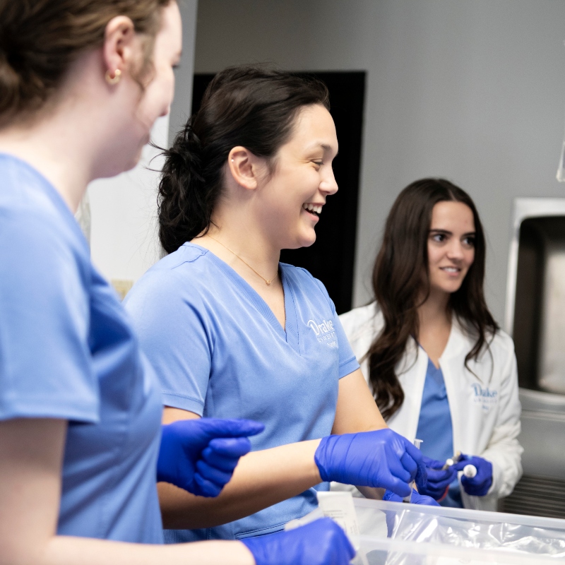 A group of Drake Pre-Nursing students in gloves handle syringes