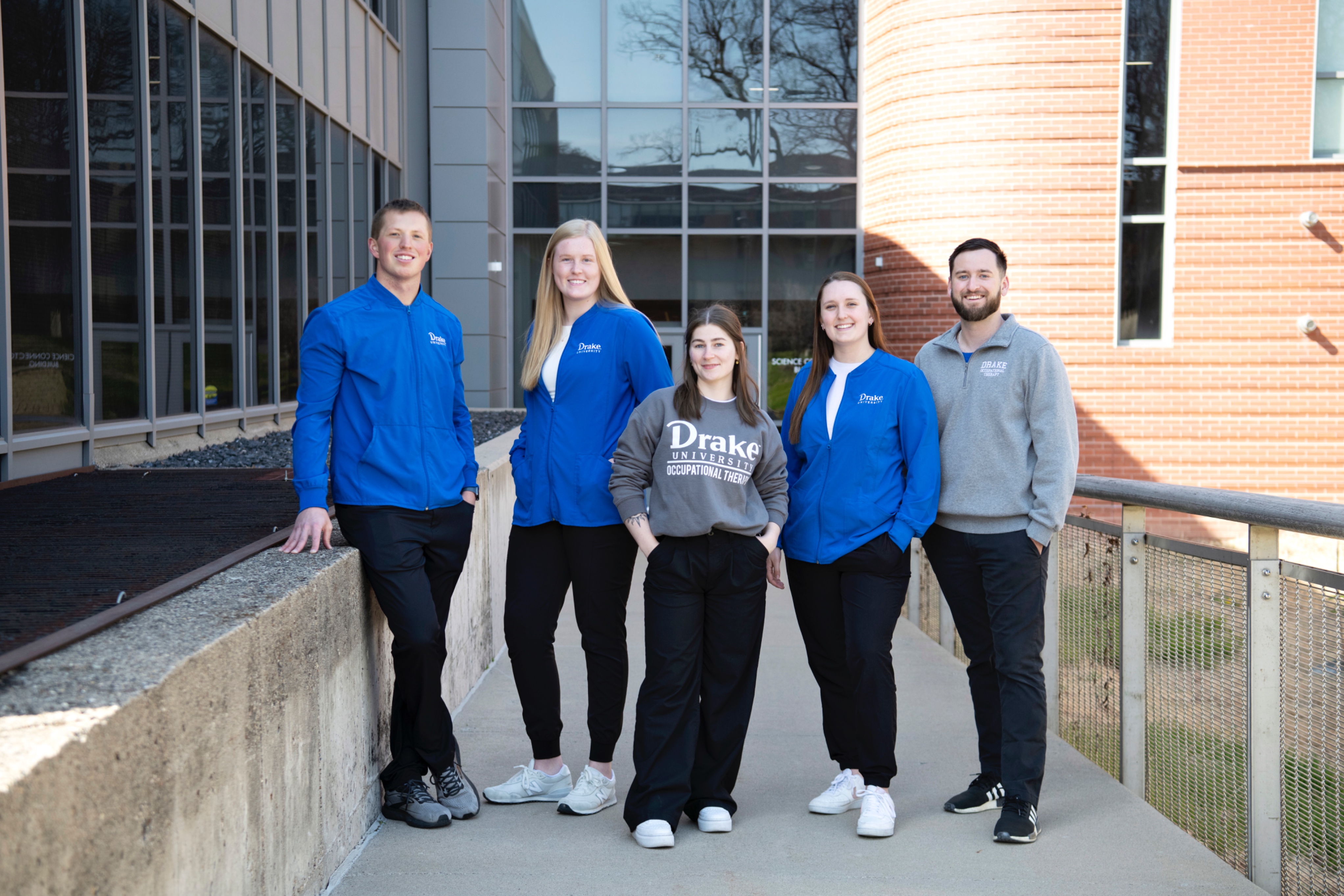 A group of Drake Pre-Occupational Therapy students stand outdoors before an organizational meeting