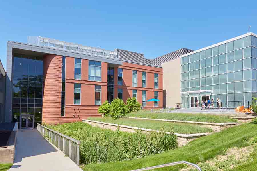 Outside the building housing Drake's Psychology programs, a modern structure with a mix of red brick and glass