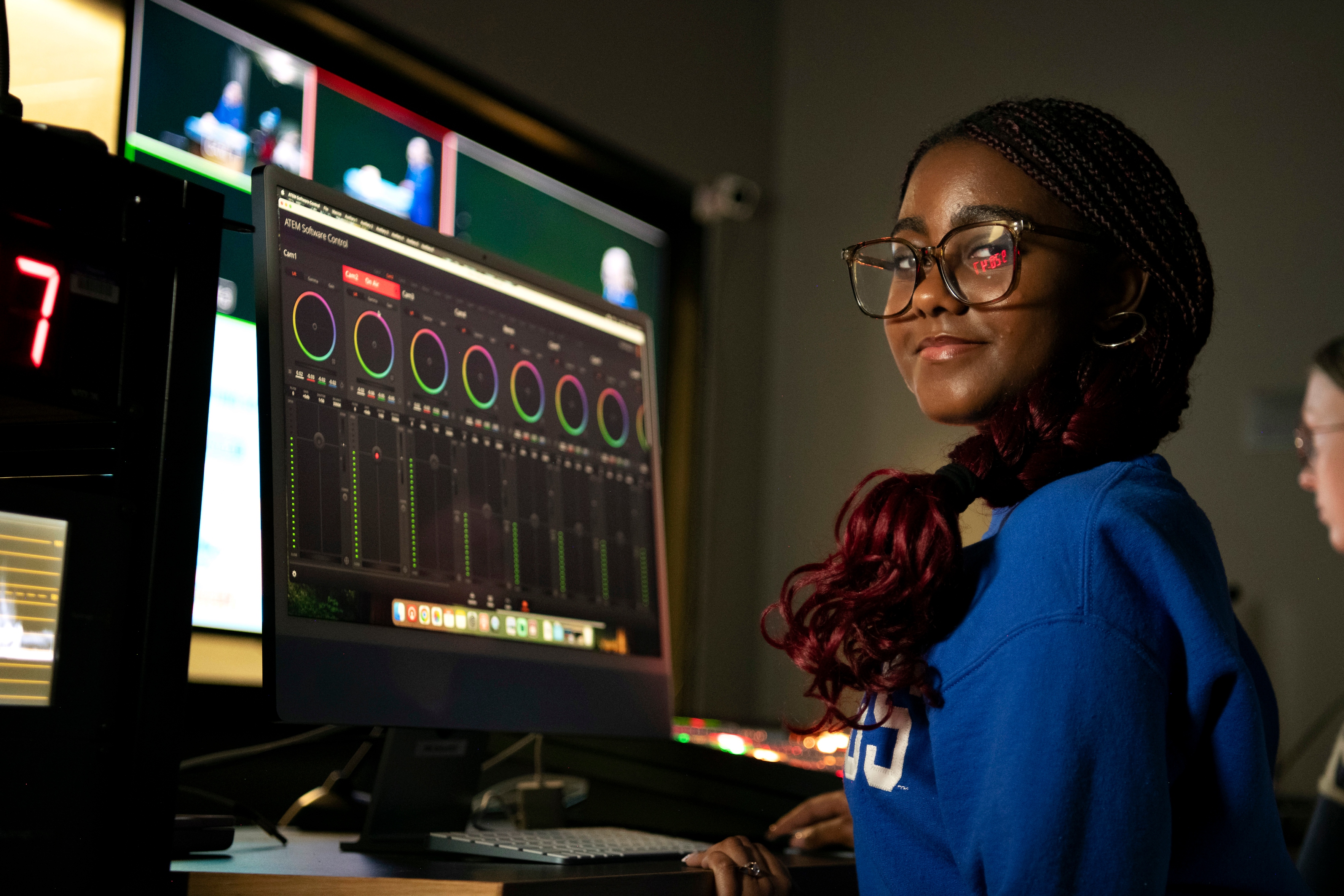 In the Drake Broadcasting System facilities, a student from Drake's Sports Media and Communication program learns to use audio software