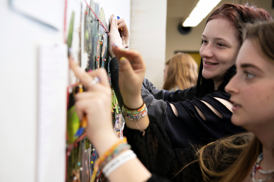Drake Studio Art students finalize a collaborative project completed for a community partner