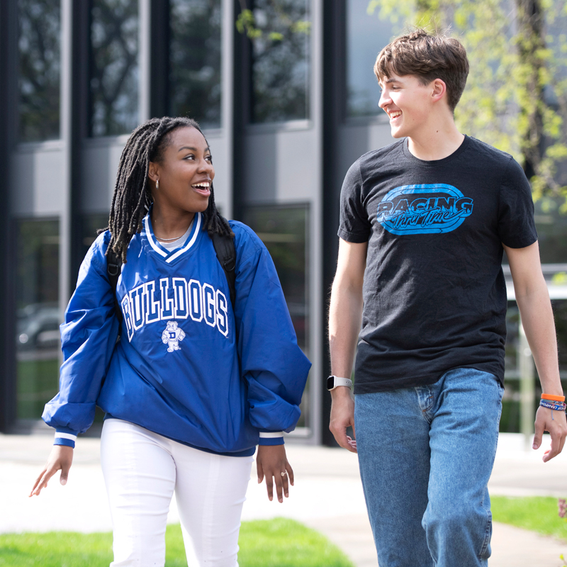 Two Drake students talk about Women's and Gender Studies topics during a walk through campus