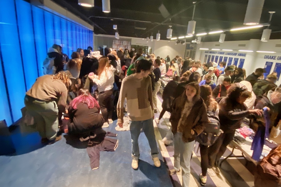 community members exploring a student made thrift shop