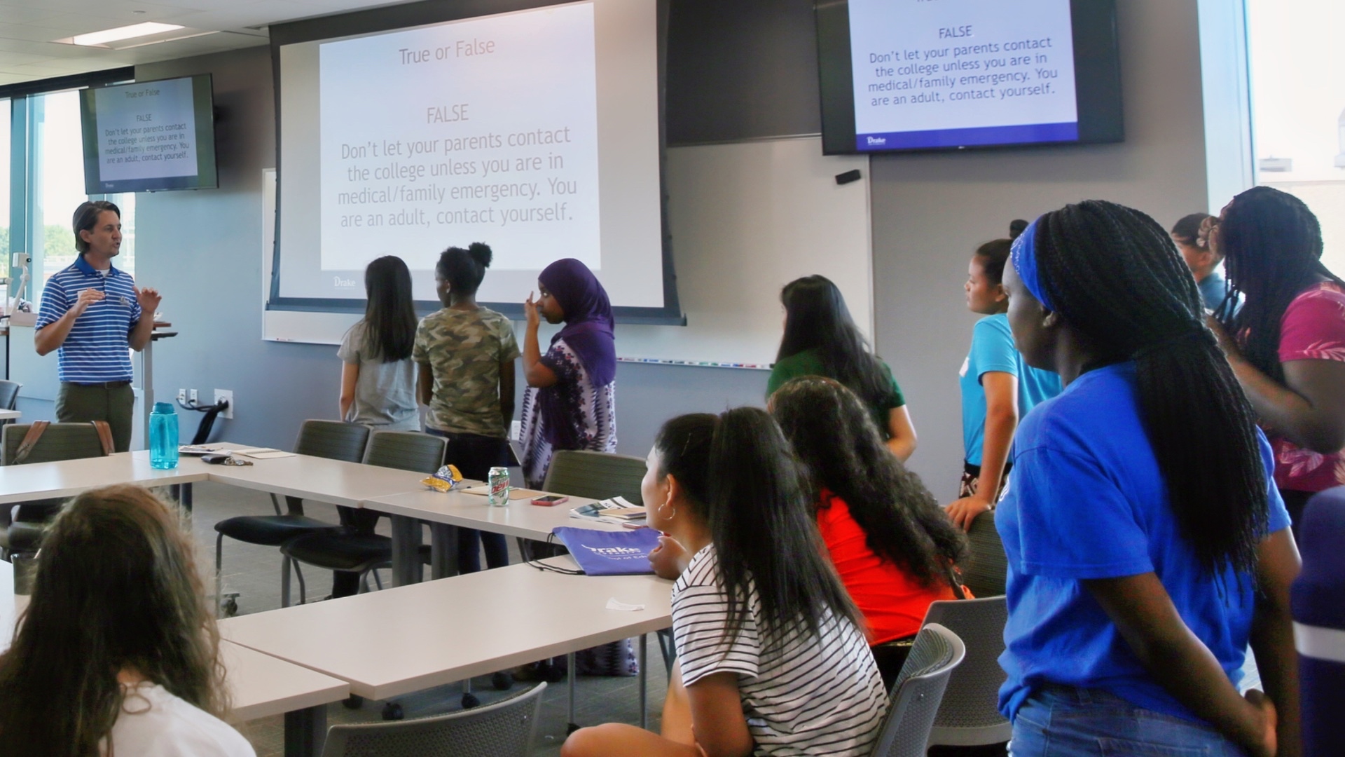 a professor speaking to older students