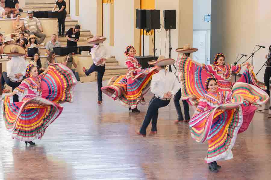 Dancers in traditional Spanish costumes during a performance