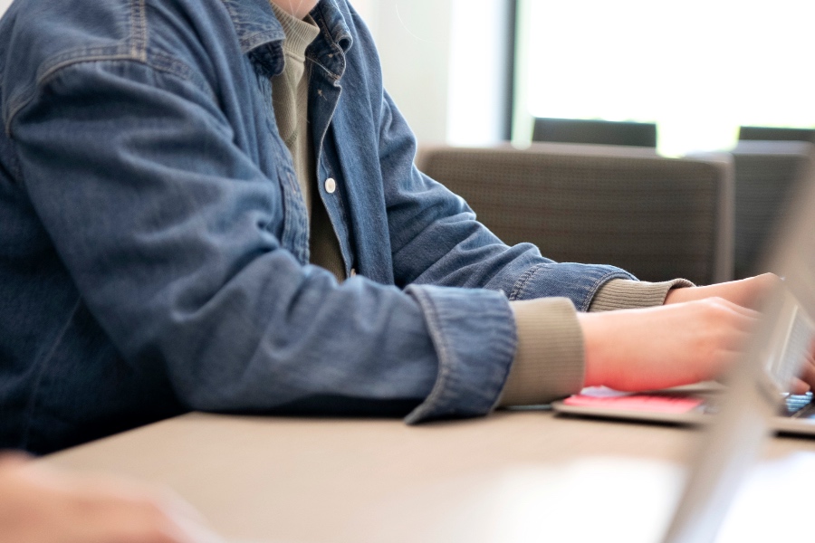 A student researching on the computer