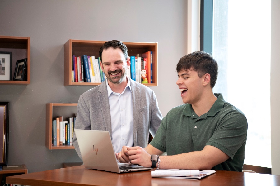 Dean Wise and a student having a discussion