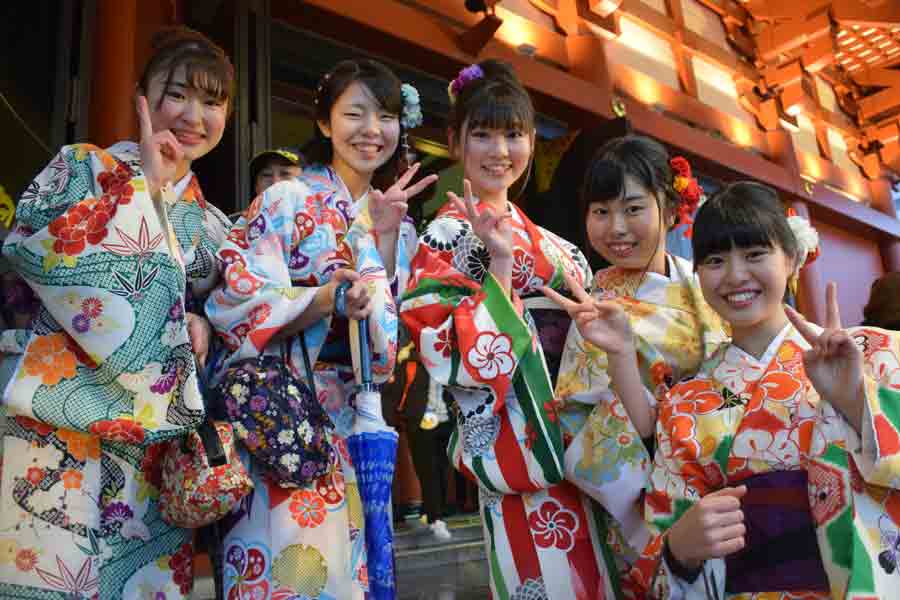 A group of women wearing traditional Japanese outfits