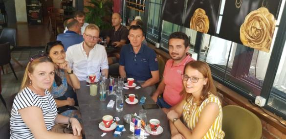 Working Worldwide Kosovo participant (third from left) out for coffee with his colleagues