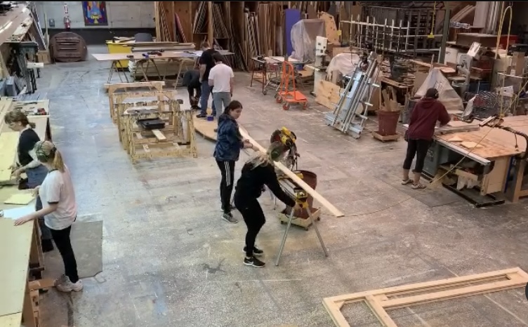 Photo of students working in the Drake Theatre Scenic studio