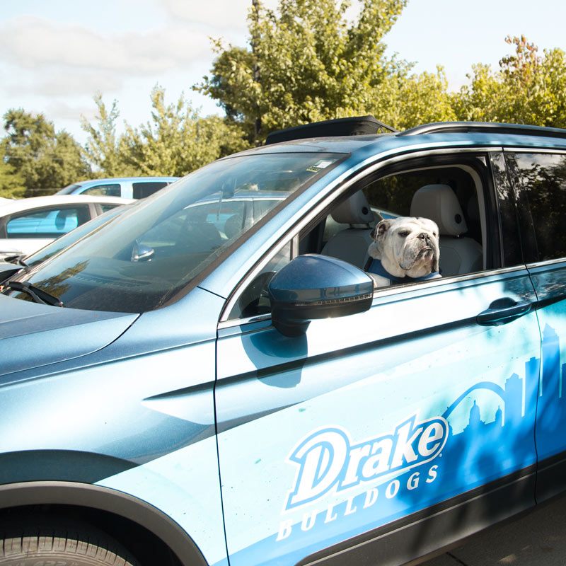 Griff II in the campus parking lot inside the Drake Bulldogs campus vehicle