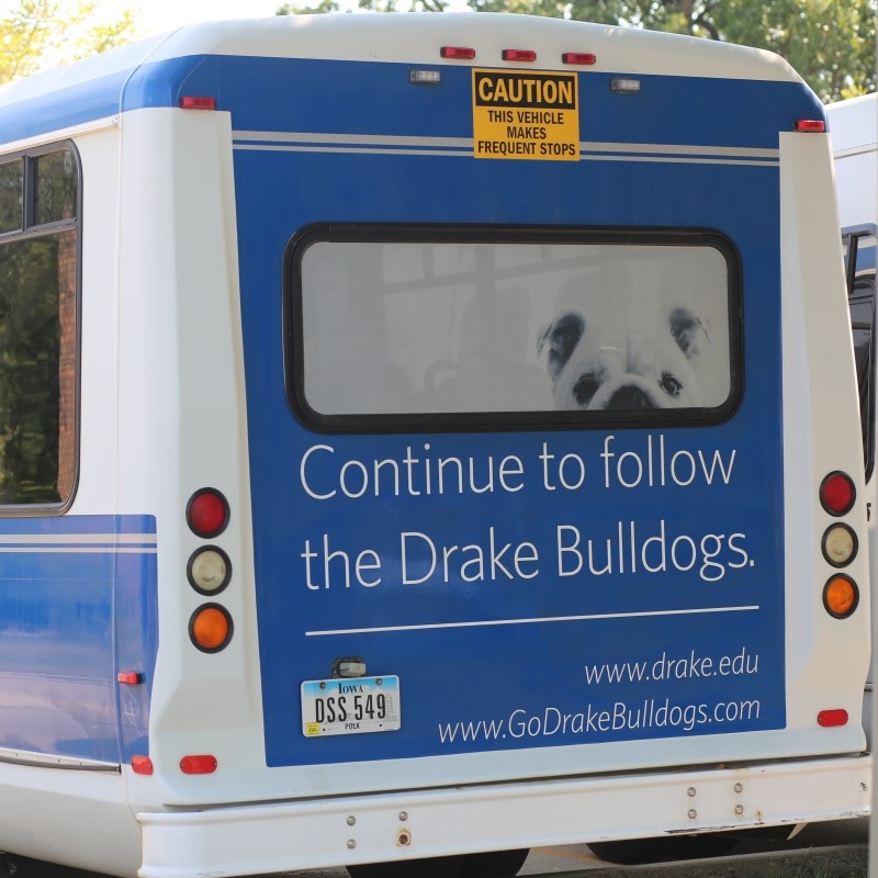 Back side of the Drake Safe Ride bus as it gives students a safe and free ride home