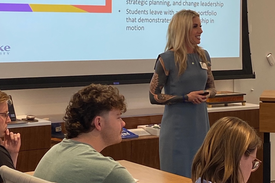 a professor opening a capstone presentation